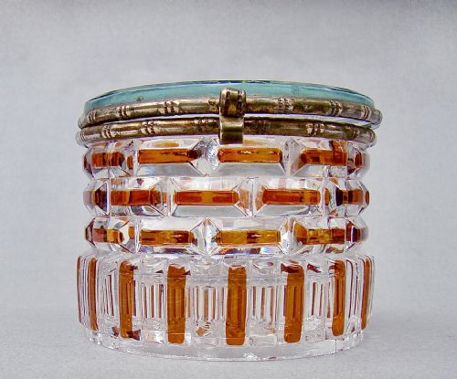 fig 1. A cylindrical French glass trinket box featuring a basketweave cut pattern with amber accents and a brass hinged rim.