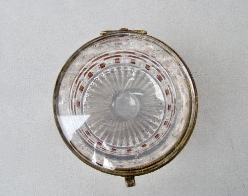 fig 2. A cylindrical French glass trinket box featuring a basketweave cut pattern with amber accents and a brass hinged rim.