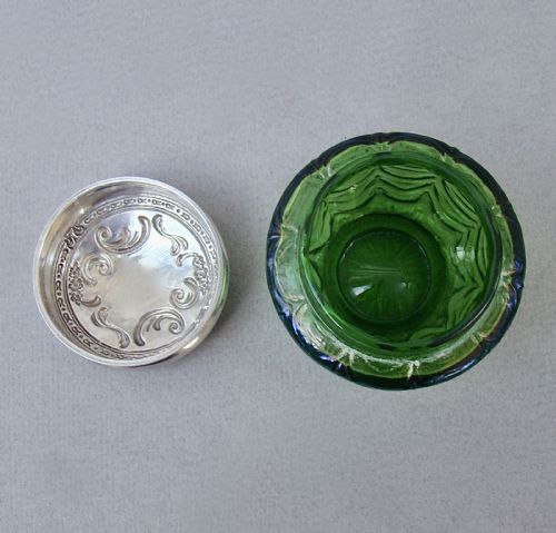 fig 2. An antique green iridescent glass trinket pot with an embossed sterling silver lid.