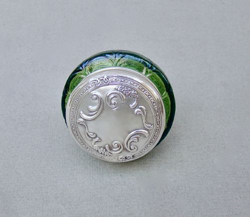 fig 3. An antique green iridescent glass trinket pot with an embossed sterling silver lid.
