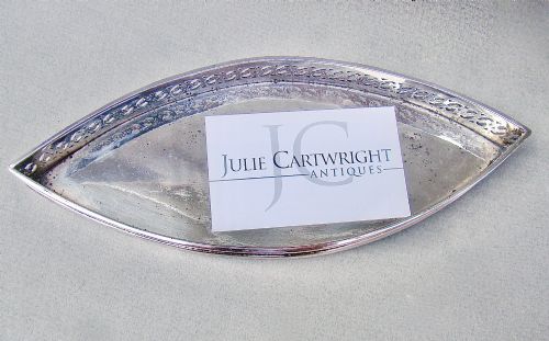 fig 2. A boat-shaped Georgian Old Sheffield plate snuffer tray featuring a pierced lattice gallery rim.