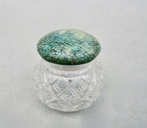 fig 1. An Art Deco cut glass rouge pot with a hallmarked silver collar and a domed green shagreen lid.