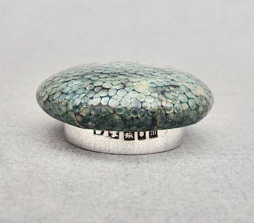fig 3. An Art Deco cut glass rouge pot with a hallmarked silver collar and a domed green shagreen lid.