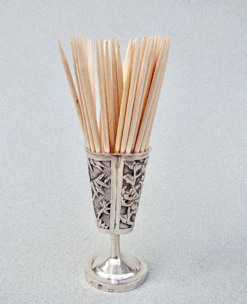 fig 1. A 19th-century Chinese export silver toothpick holder featuring repousse bamboo motifs on a pedestal base with maker hallmarks stamped on the foot rim.