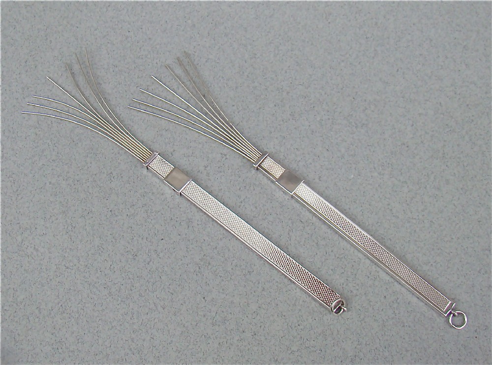PAIR OF ART DECO SILVER COCKTAIL SWIZZLE STICKS, CIRCA 1930