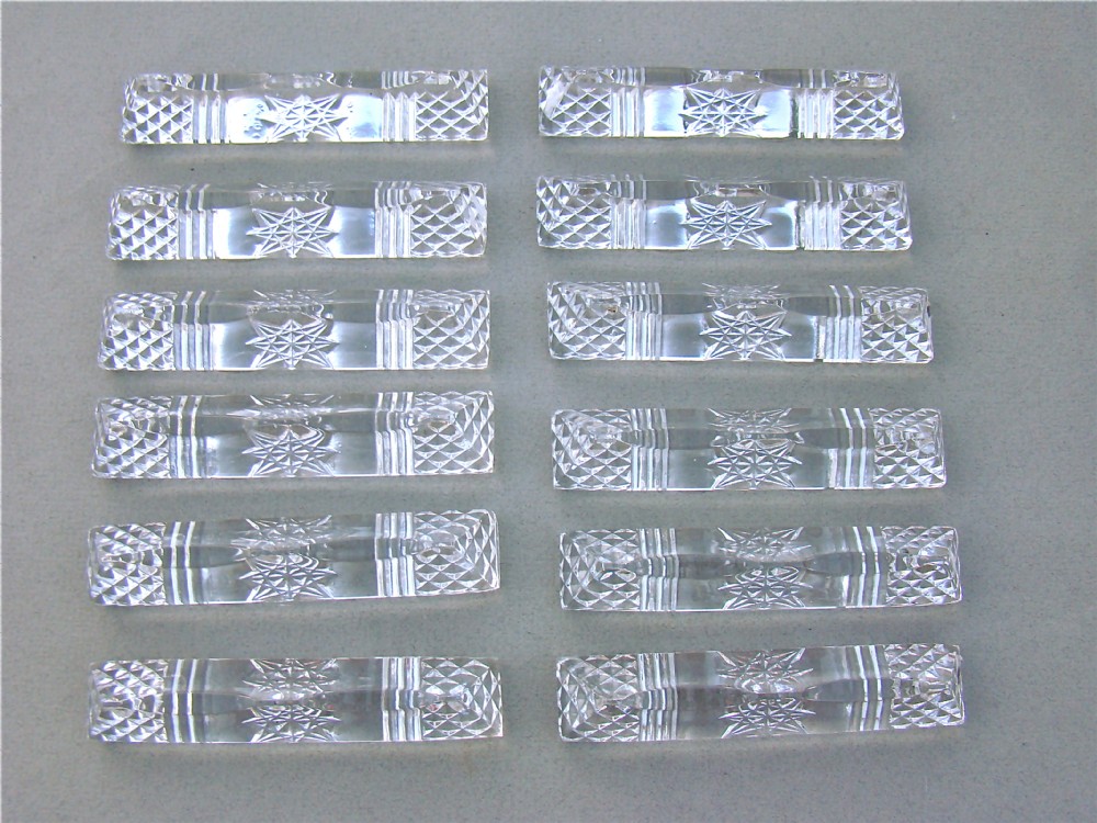CASED SET OF TWELVE FRENCH LEAD CRYSTAL KNIFE RESTS, CIRCA 1910