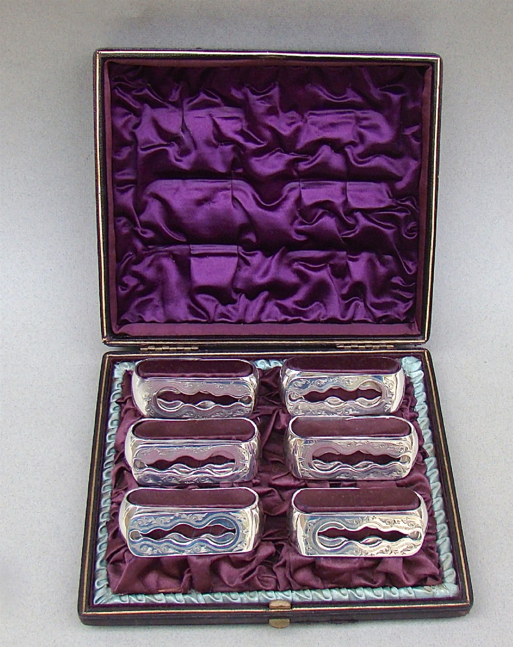 CASED SET OF SIX VICTORIAN SILVER PLATED NUMBERED NAPKIN RINGS, CIRCA 1870