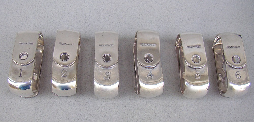 CASED SET OF SIX VICTORIAN SILVER PLATED NUMBERED NAPKIN RINGS, CIRCA 1870 View III