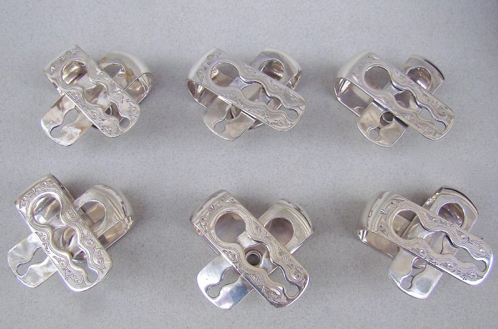 CASED SET OF SIX VICTORIAN SILVER PLATED NUMBERED NAPKIN RINGS, CIRCA 1870 View IV