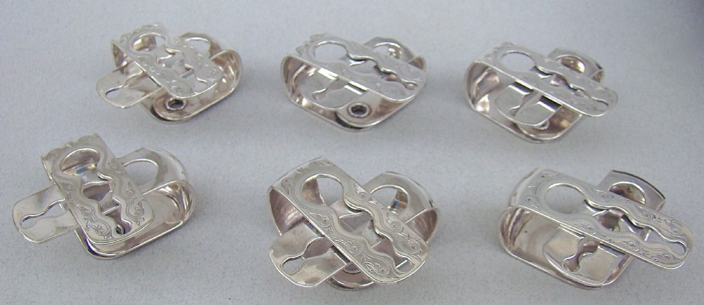 CASED SET OF SIX VICTORIAN SILVER PLATED NUMBERED NAPKIN RINGS, CIRCA 1870 View VI