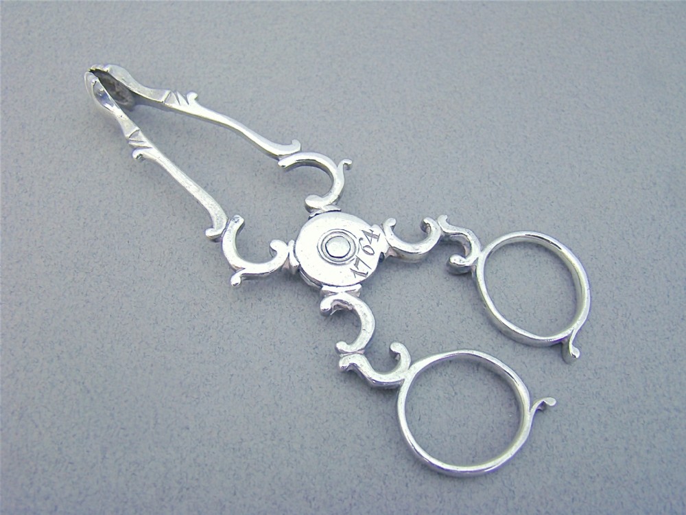 PAIR OF GEORGIAN SILVER SUGAR NIPS BY STEPHEN ADAMS I, LONDON 1764