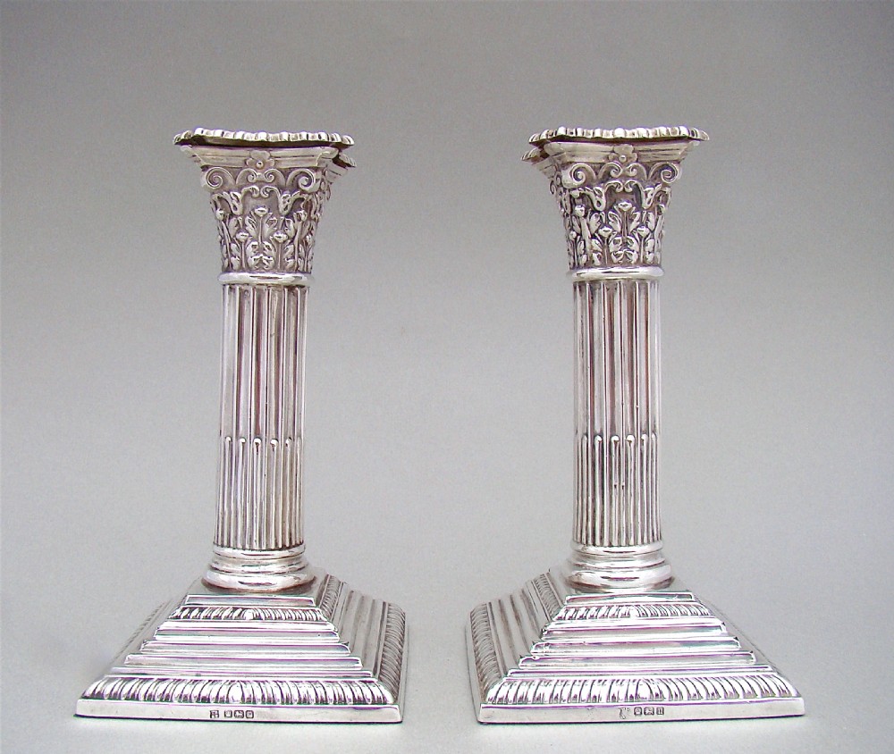 PAIR OF GEORGE V STERLING SILVER CORINTHIAN COLUMN CANDLESTICKS BY THOMAS BRADBURY & SONS, SHEFFIELD 1915