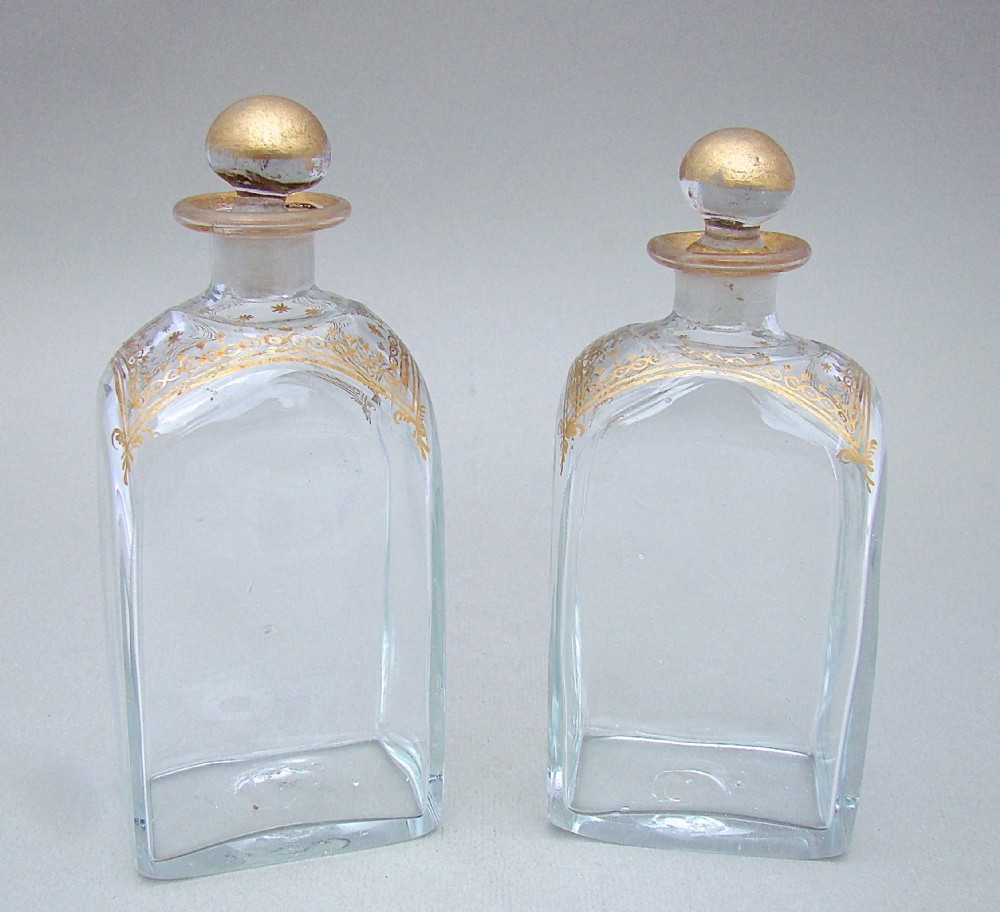 PAIR OF GEORGIAN GILT GLASS COLOGNE BOTTLES , CIRCA 1795