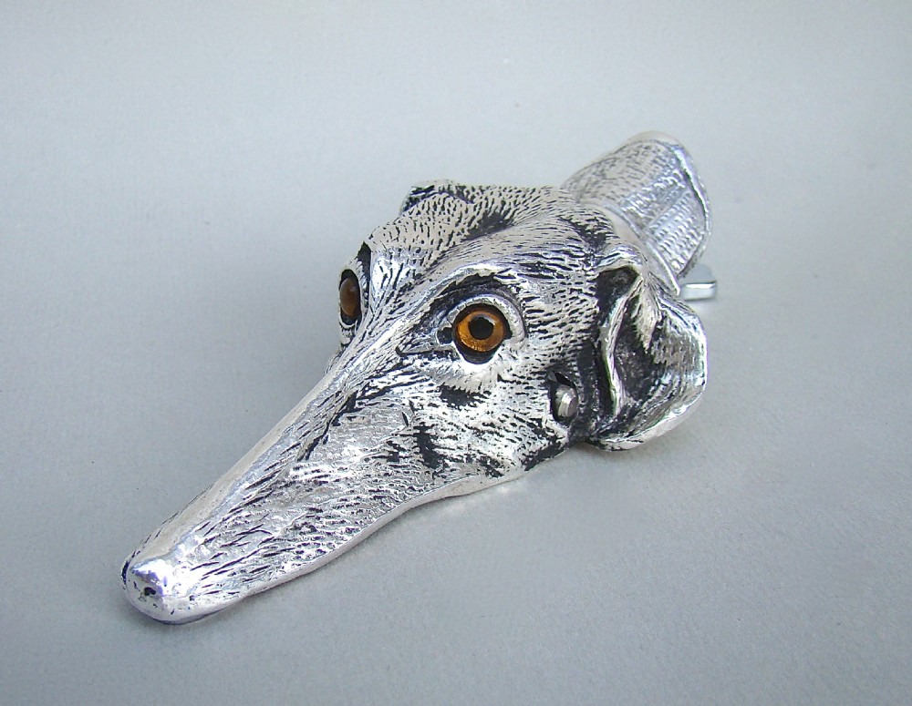 NOVELTY SILVER PLATED PAPER CLIP IN THE SHAPE OF A DOG'S HEAD, CIRCA 1920