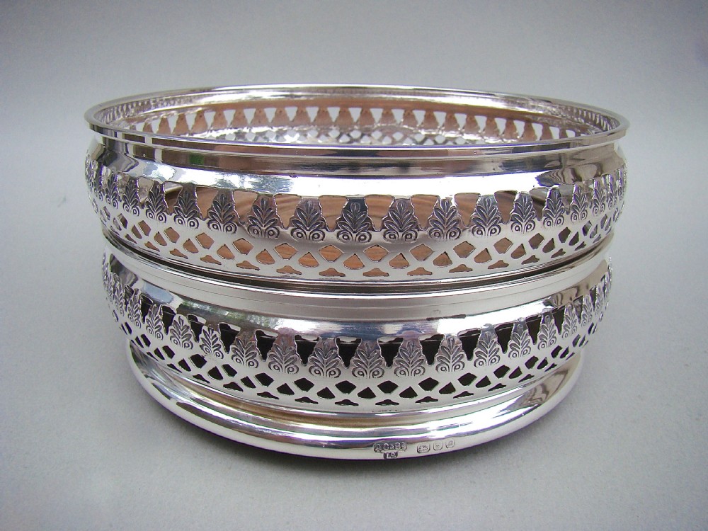 PAIR OF MID 20TH CENTURY SOLID SILVER WINE COASTERS BY A. CHICK & SONS LTD, LONDON 1968. 
 View VII