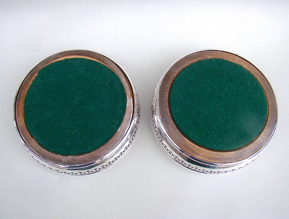 PAIR OF MID 20TH CENTURY SOLID SILVER WINE COASTERS BY A. CHICK & SONS LTD, LONDON 1968. 
 View VIII