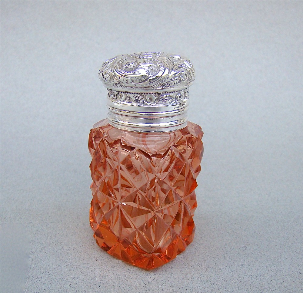UNUSUAL VICTORIAN SILVER & CUT GLASS HEART-SHAPED SCENT BOTTLE , CIRCA 1895