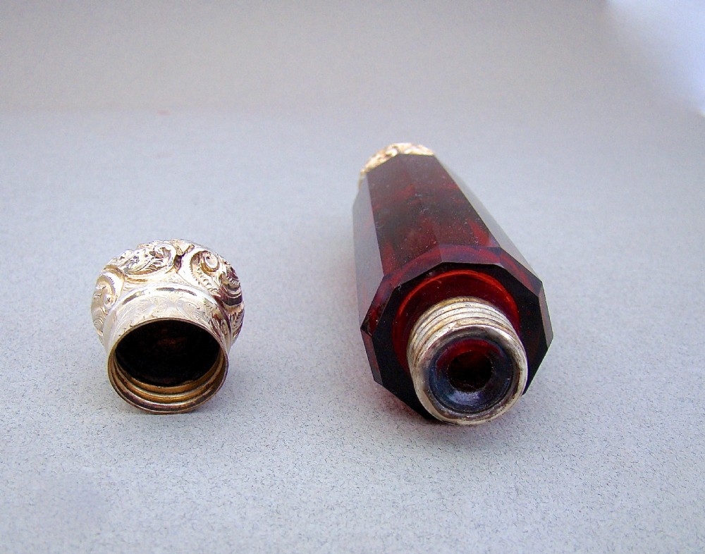 VICTORIAN SILVER GILT RUBY GLASS DOUBLE-ENDED SCENT BOTTLE, CIRCA 1880

 View IV