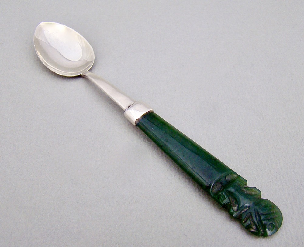 NEW ZEALAND STERLING SILVER AND CARVED JADE SMALL SPOON, CIRCA 1920