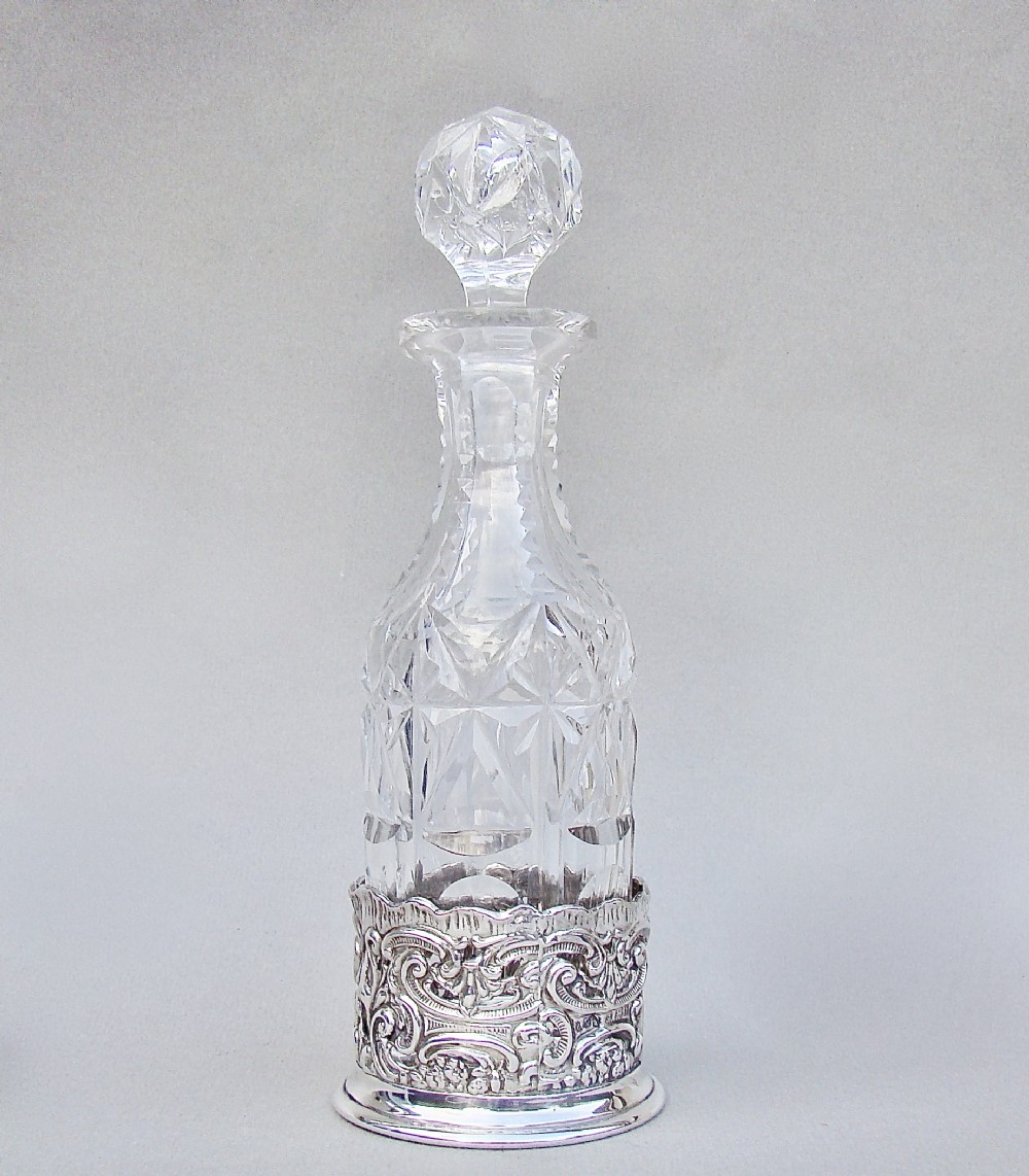EDWARDIAN SILVER CONDIMENT COASTER WITH SLICED-CUT CRYSTAL CONDIMENT BOTTLE, BIRMINGHAM 1901