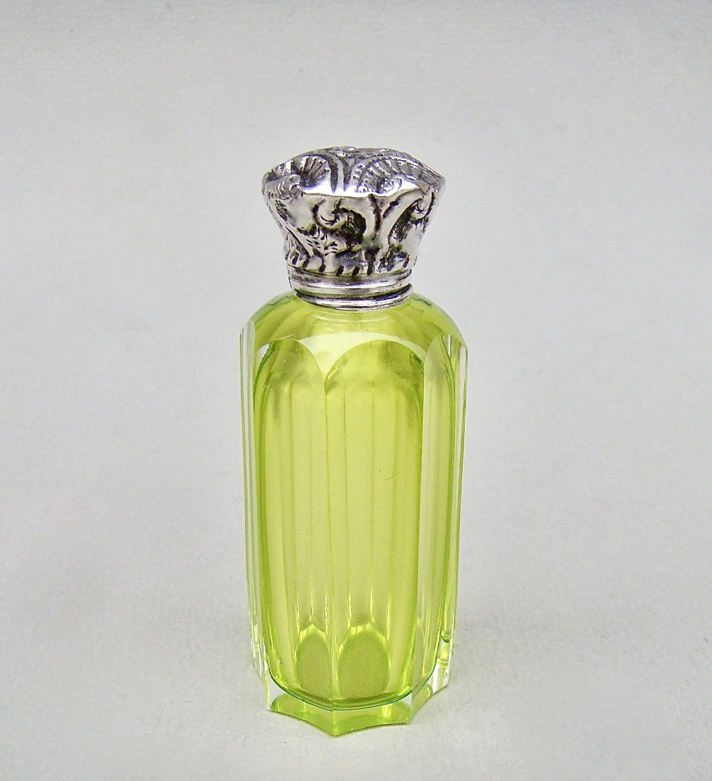 VICTORIAN SILVER & LIME GREEN SLICED-CUT GLASS SCENT BOTTLE , CIRCA 1890