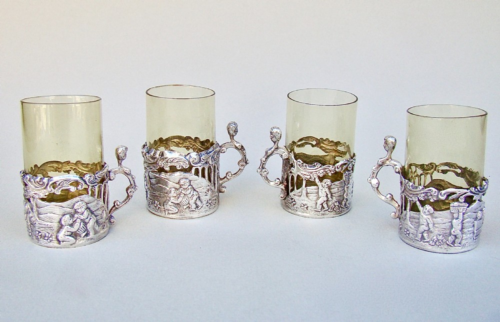 DELIGHTFUL SET OF FOUR VICTORIAN SILVER & AMBER GLASS TEA HOLDERS BY WILLIAM COMYNS, LONDON 1889 View II