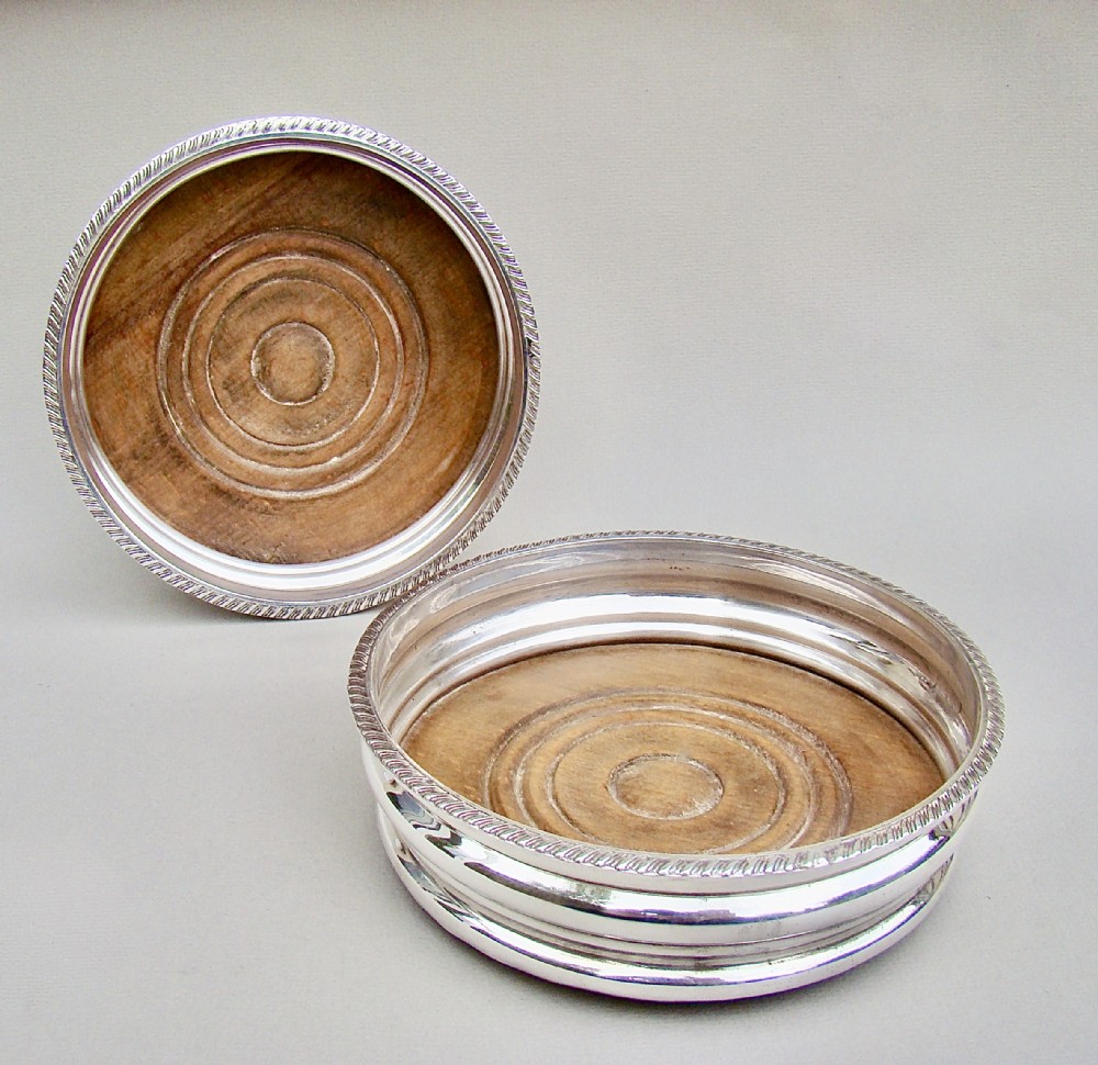 PAIR OF TURN OF THE CENTURY SILVER PLATED WINE COASTERS, CIRCA 1900