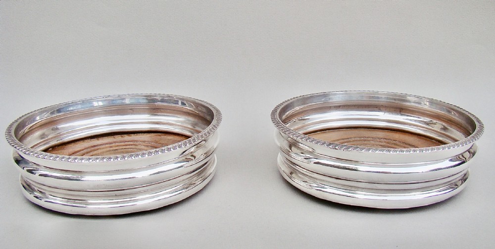 PAIR OF TURN OF THE CENTURY SILVER PLATED WINE COASTERS, CIRCA 1900 View III