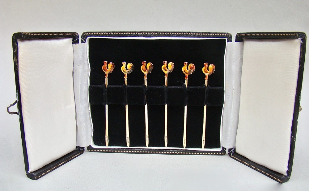 MID-CENTURY CASED SET OF SIX SILVER GILT & ENAMELLED COCKEREL COCKTAIL STICKS BY THE ADIE BROTHERS, BIRMINGHAM 1957