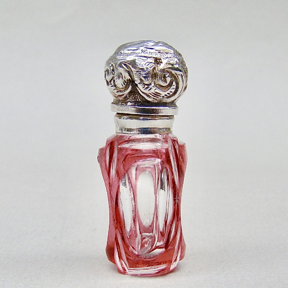 MINIATURE VICTORIAN SILVER & OVERLAY CRANBERRY GLASS SCENT BOTTLE, CIRCA 1890