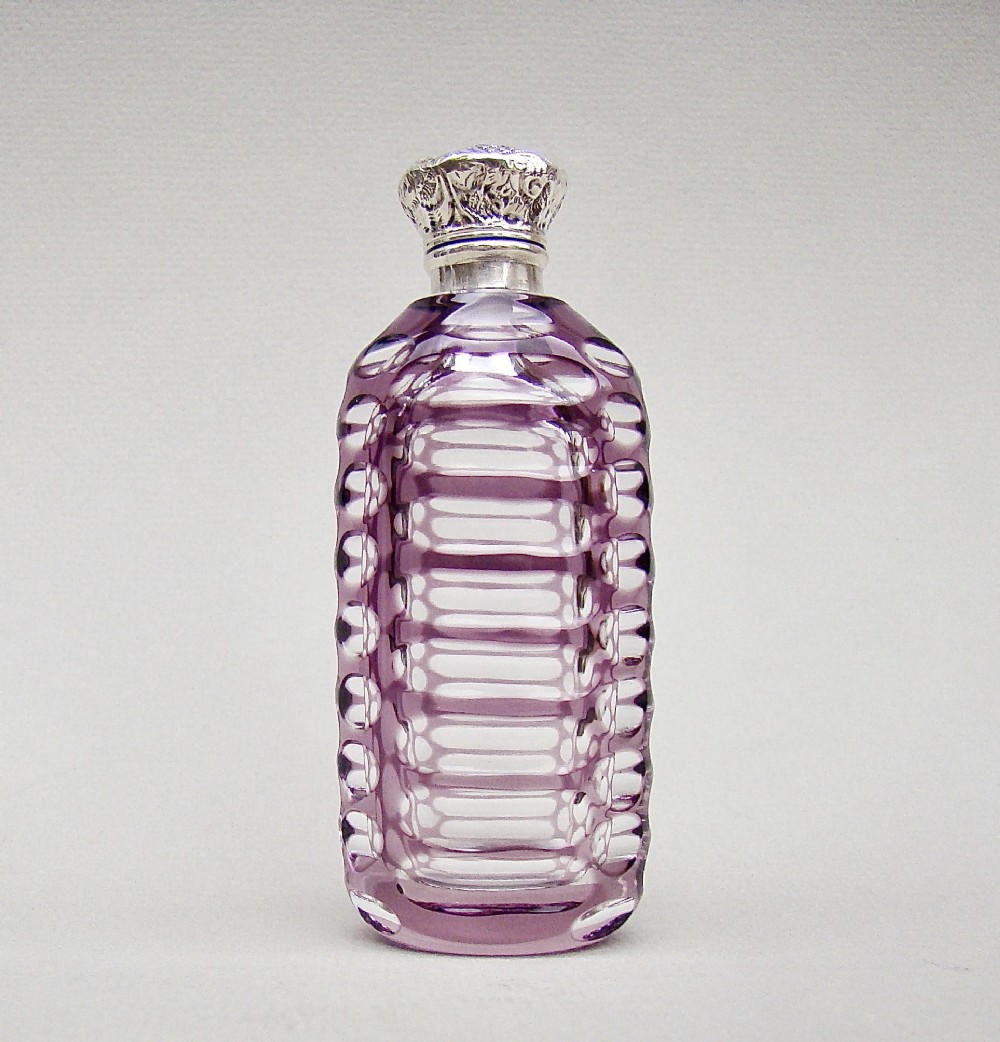 VICTORIAN SILVER AND AMETHYST OVERLAY BOHEMIAN GLASS SCENT BOTTLE, CIRCA 1890
