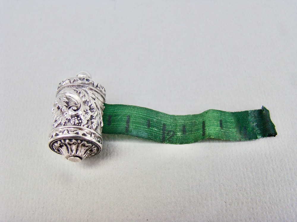 EXQUISITE EARLY VICTORIAN SILVER TAPE MEASURE, CIRCA 1840