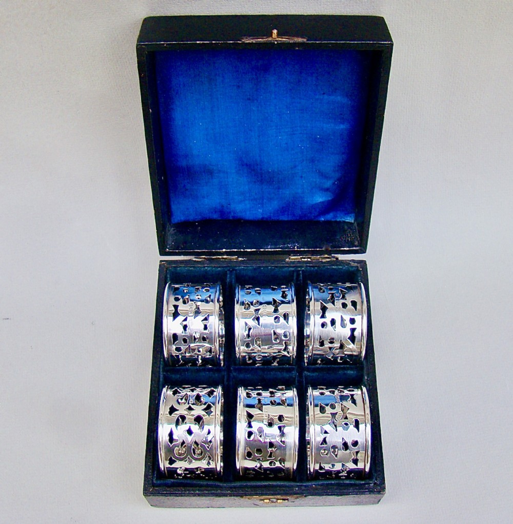 MATCHED CASED SET OF SIX EDWARDIAN SOLID SILVER NAPKIN RINGS BY BROADWAY & CO,  BIRMINGHAM CIRCA 1910