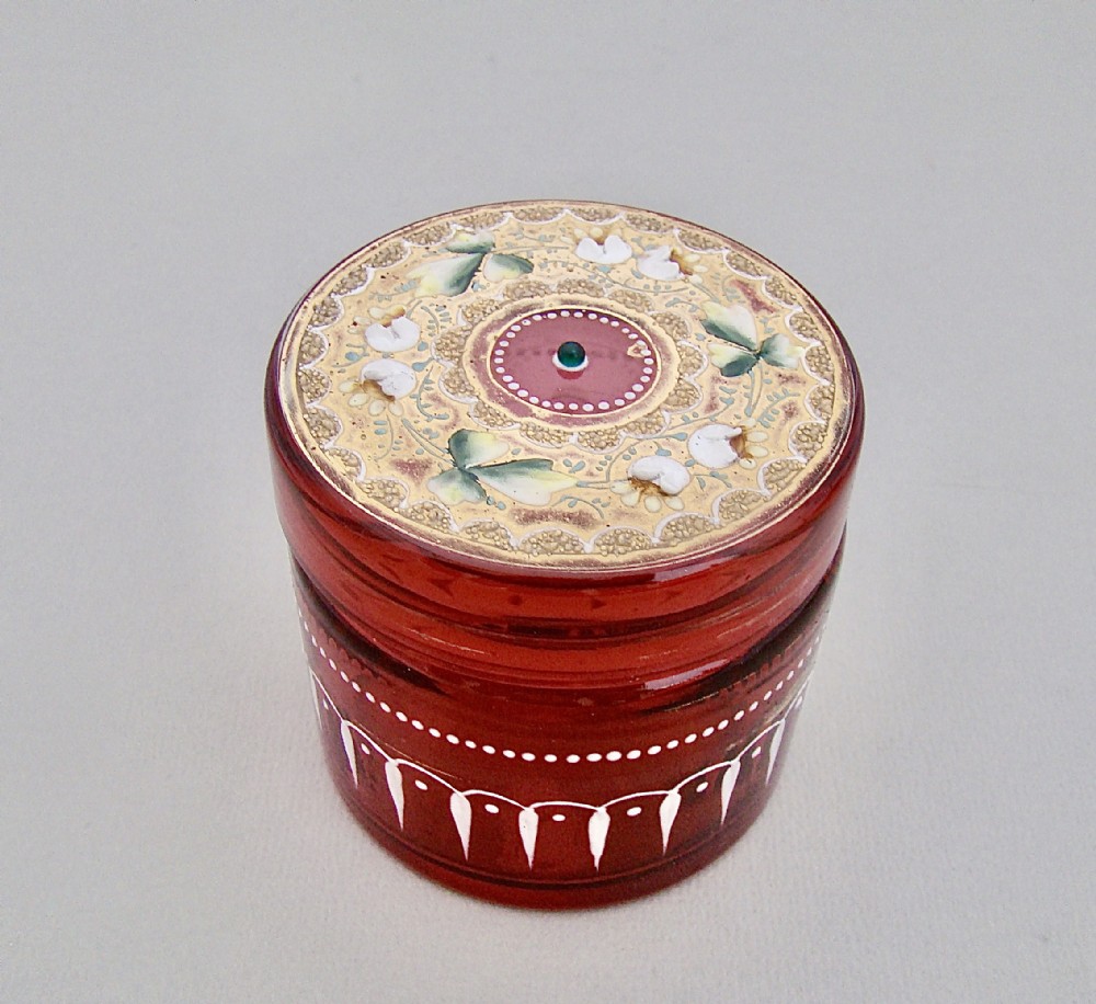 19TH C. MOSER CRANBERRY AND GILT GLASS DRESSING TABLE JAR, CIRCA 1890
