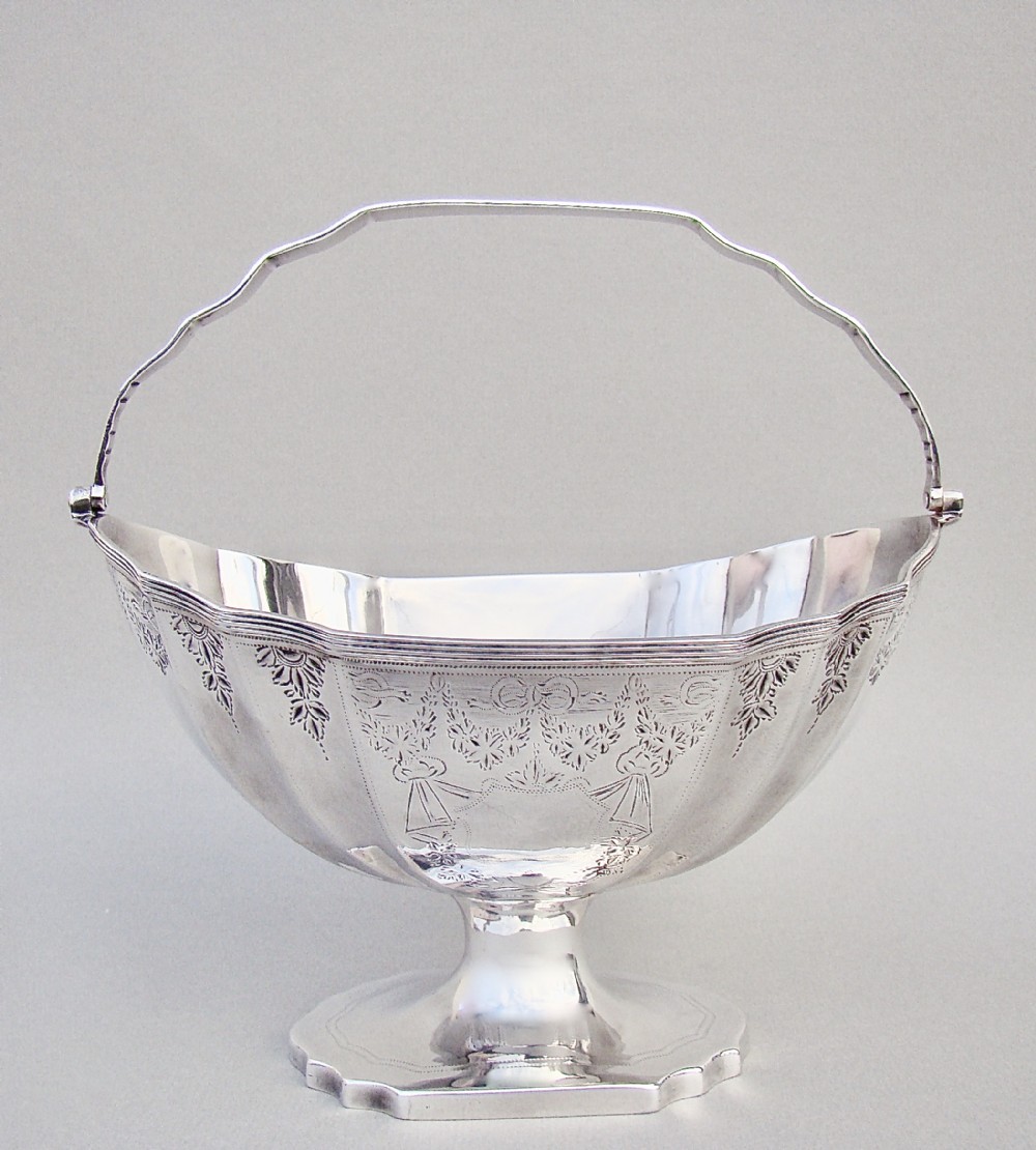 GEORGIAN SILVER SWING-HANDLED SUGAR BASKET BY SOLOMON HOUGHMAN, LONDON 1795

