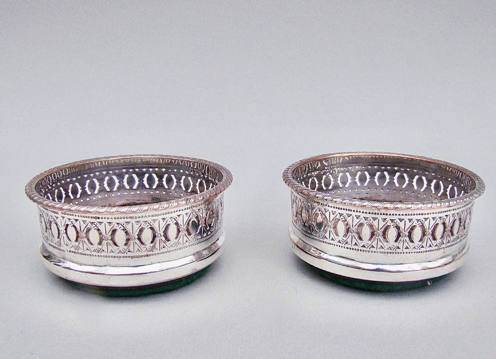 PAIR OF EDWARDIAN SILVER PLATED CONDIMENT COASTERS, CIRCA 1910