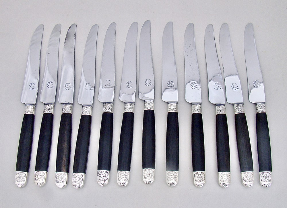 FABULOUS CASED SET OF TWELVE SILVER PLATED FRENCH TABLE KNIVES WITH EBONY HANDLES AND STEEL BLADES, PARIS CIRCA 1890