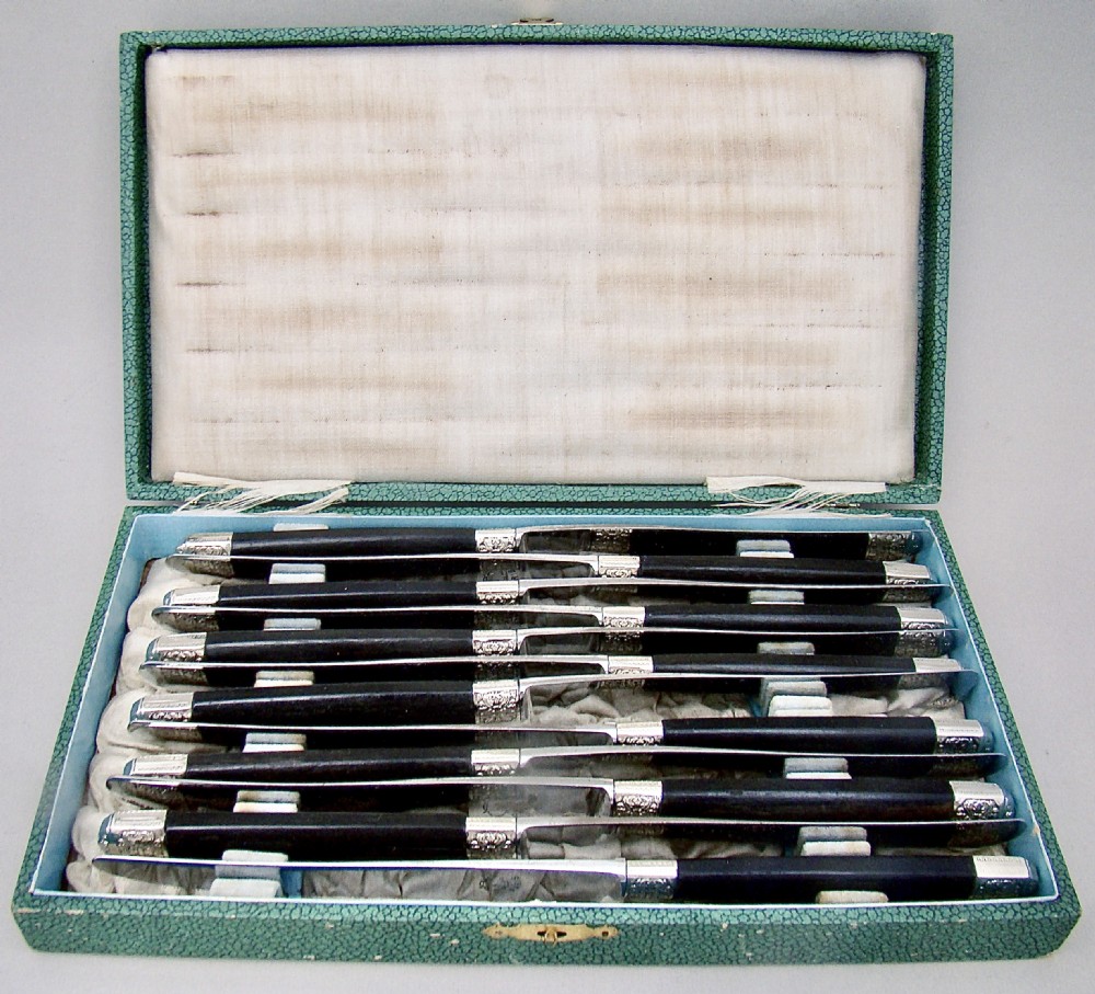 FABULOUS CASED SET OF TWELVE SILVER PLATED FRENCH TABLE KNIVES WITH EBONY HANDLES AND STEEL BLADES, PARIS CIRCA 1890 View II
