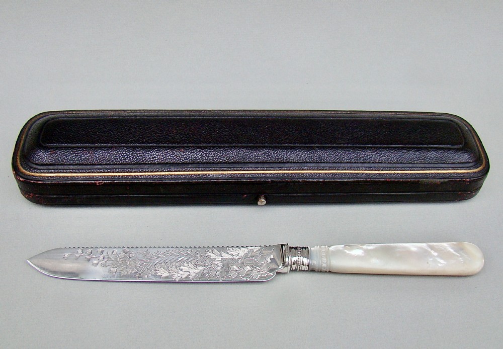 CASED VICTORIAN SOLID SILVER AND MOTHER OF PEARL CAKE KNIFE BY THE ATKINS BROTHERS, SHEFFIELD 1892 View II