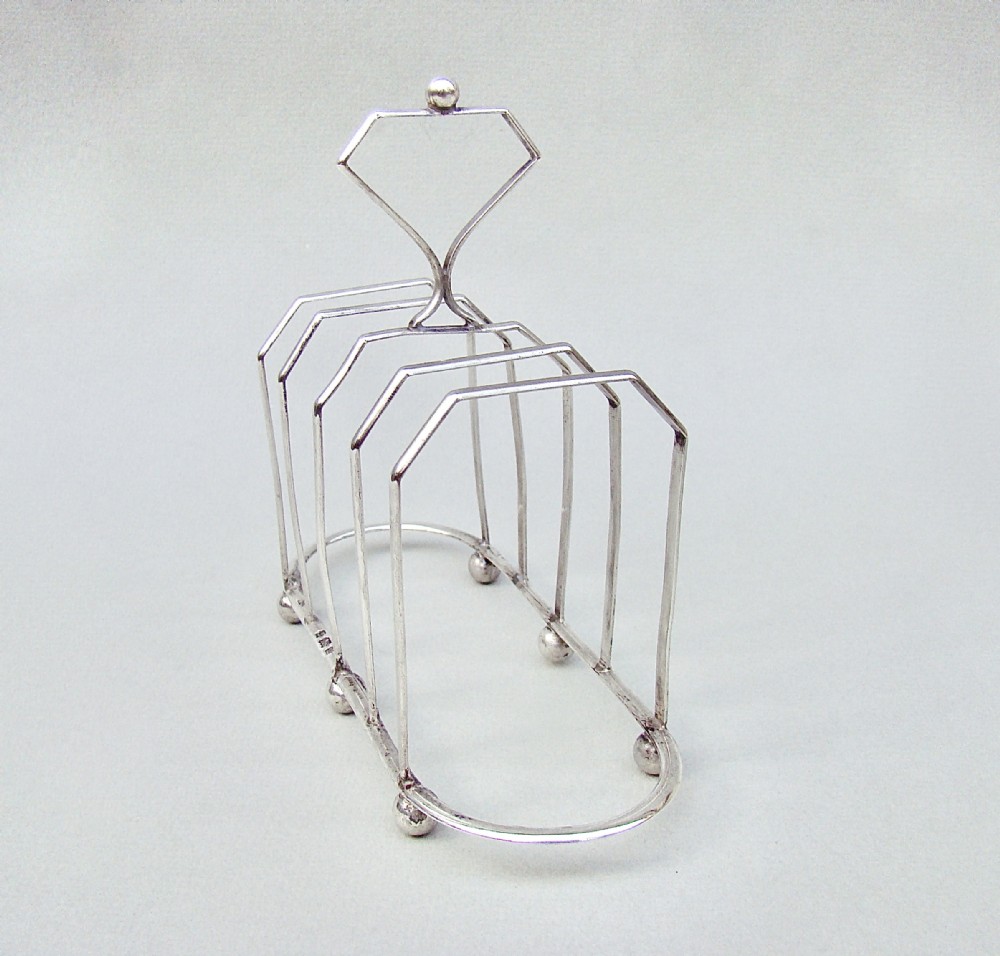 UNUSUAL VICTORIAN SILVER FIVE DIVISION TOAST RACK BY THE WILLIAM DEVENPORT, BIRMINGHAM 1900