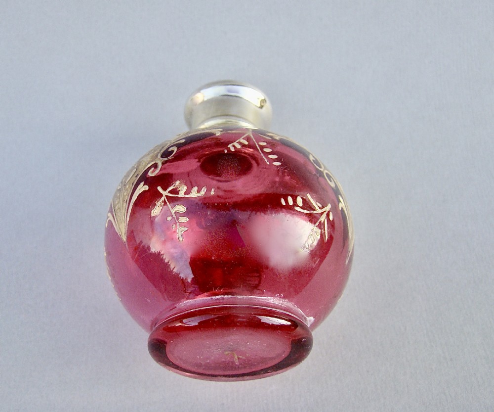 VICTORIAN SILVER GILT ENAMELLED CRANBERRY GLASS SCENT BOTTLE, CIRCA 1890 View V