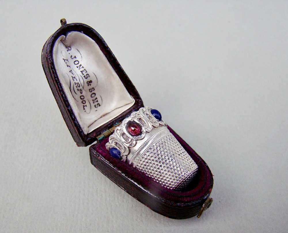 RARE CASED CONTINENTAL SILVER THIMBLE SET WITH SEMI-PRECIOUS STONES, CIRCA 1890