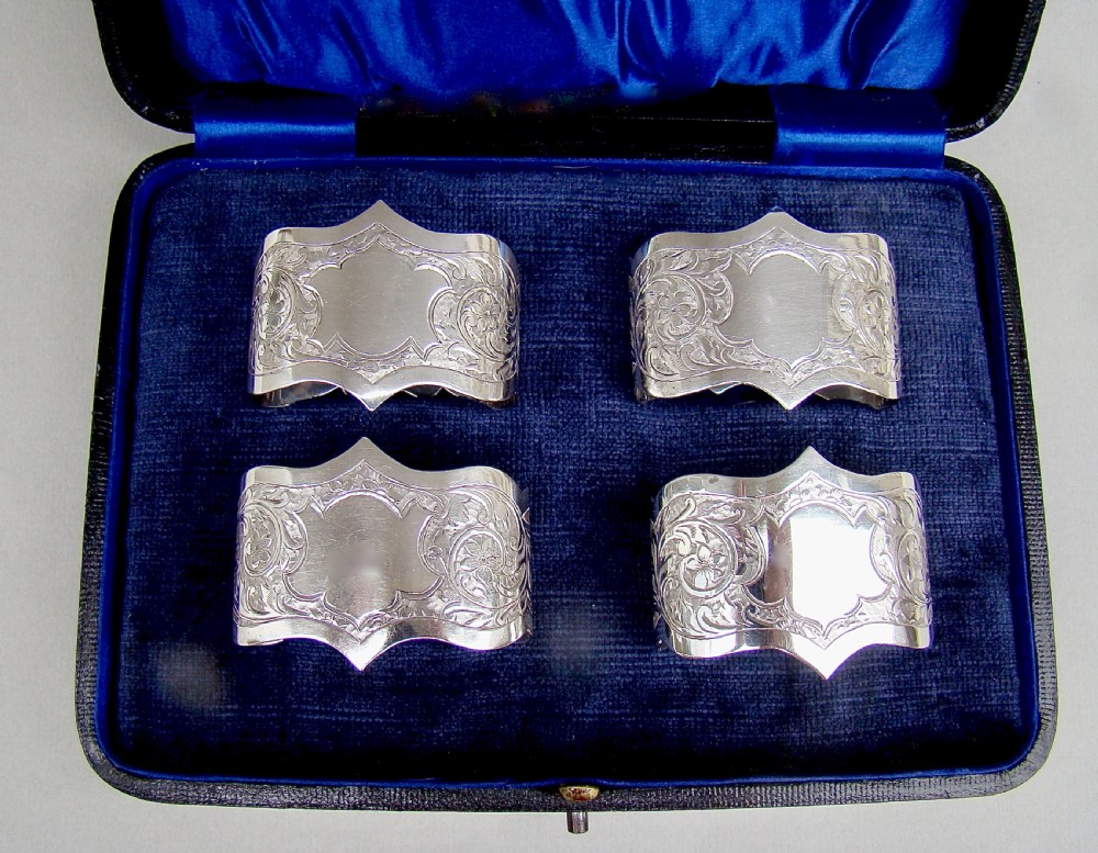 CASED SET OF FOUR EDWARDIAN SOLID SILVER NAPKIN RINGS BY ROBERT CHANDLER, BIRMINGHAM 1904
