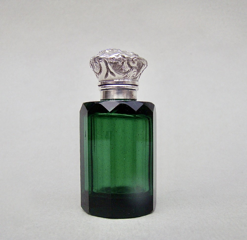 SMALL VICTORIAN SILVER MOUNTED GREEN GLASS GLASS SCENT BOTTLE , CIRCA 1890