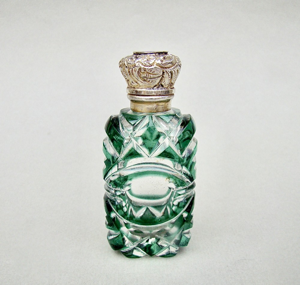 VICTORIAN SILVER GILT AND BRISTOL GREEN OVERLAY BOHEMIAN GLASS SCENT BOTTLE, CIRCA 1890