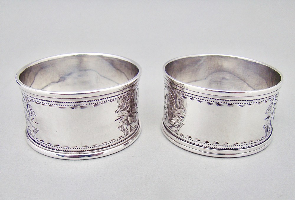 CASED PAIR OF EDWARDIAN ENGRAVED SILVER NAPKIN RINGS BY THE ROLASON BROTHERS, CHESTER 1903 View III