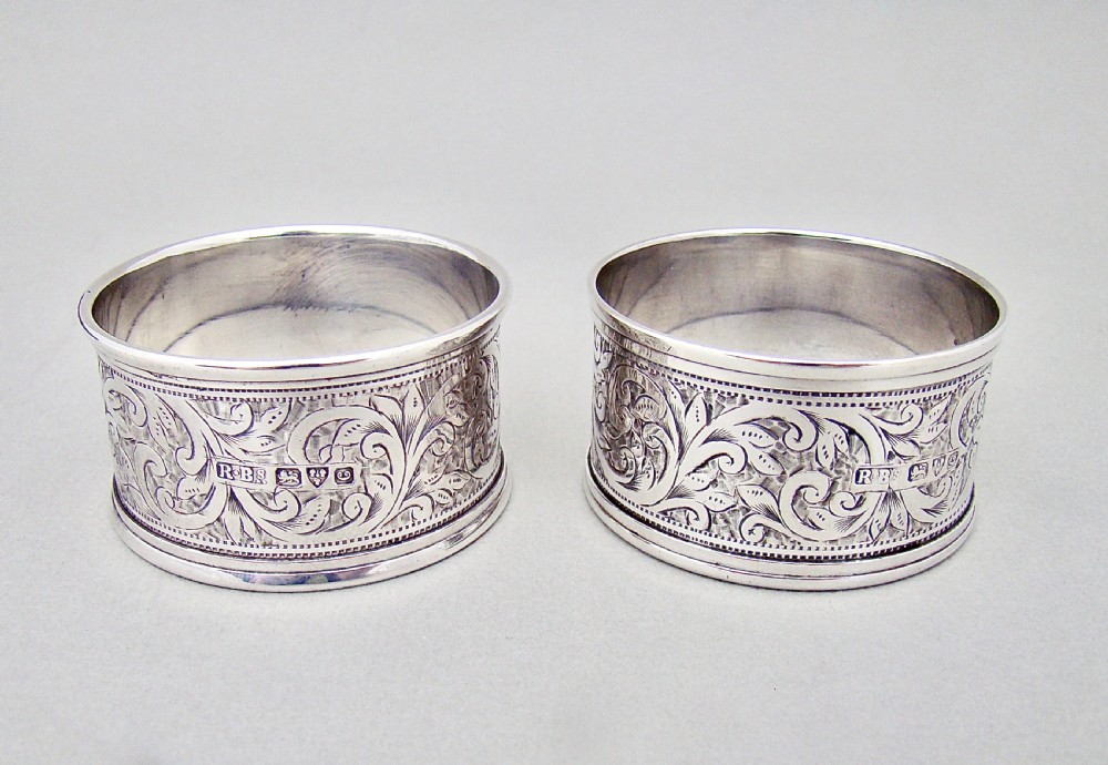 CASED PAIR OF EDWARDIAN ENGRAVED SILVER NAPKIN RINGS BY THE ROLASON BROTHERS, CHESTER 1903 View IV