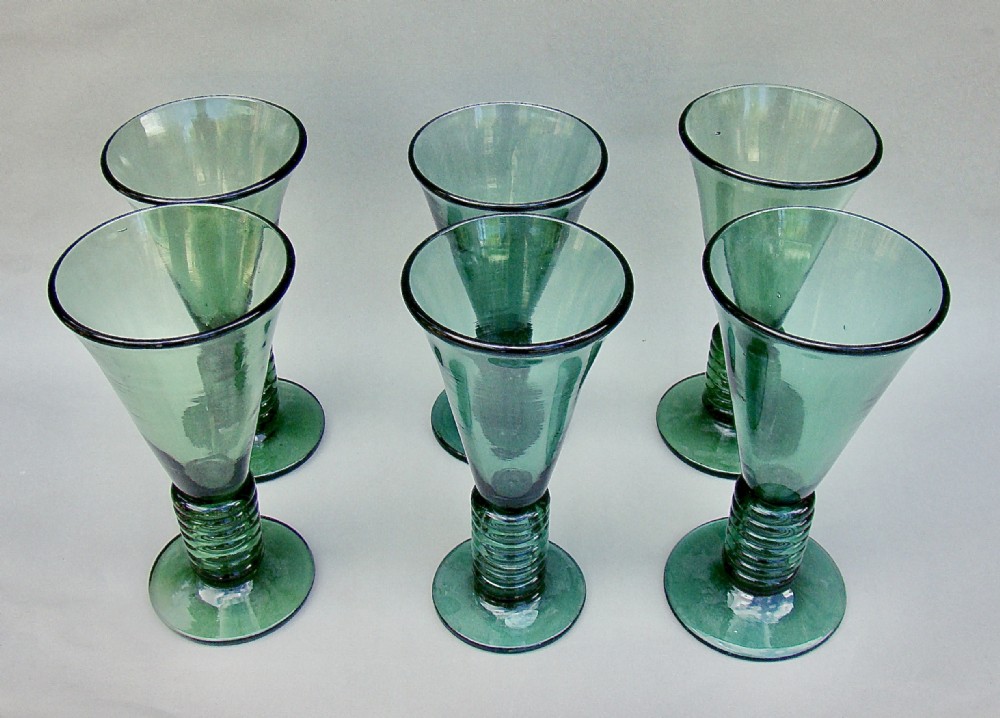 UNUSUAL SET OF SIX 19TH CENTURY COIL STEMMED GREEN  GLASSES, CIRCA 1890