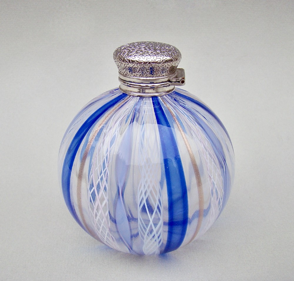 DELIGHTFUL VICTORIAN SILVER MOUNTED TRAILED GLASS SCENT BOTTLE, CIRCA 1890