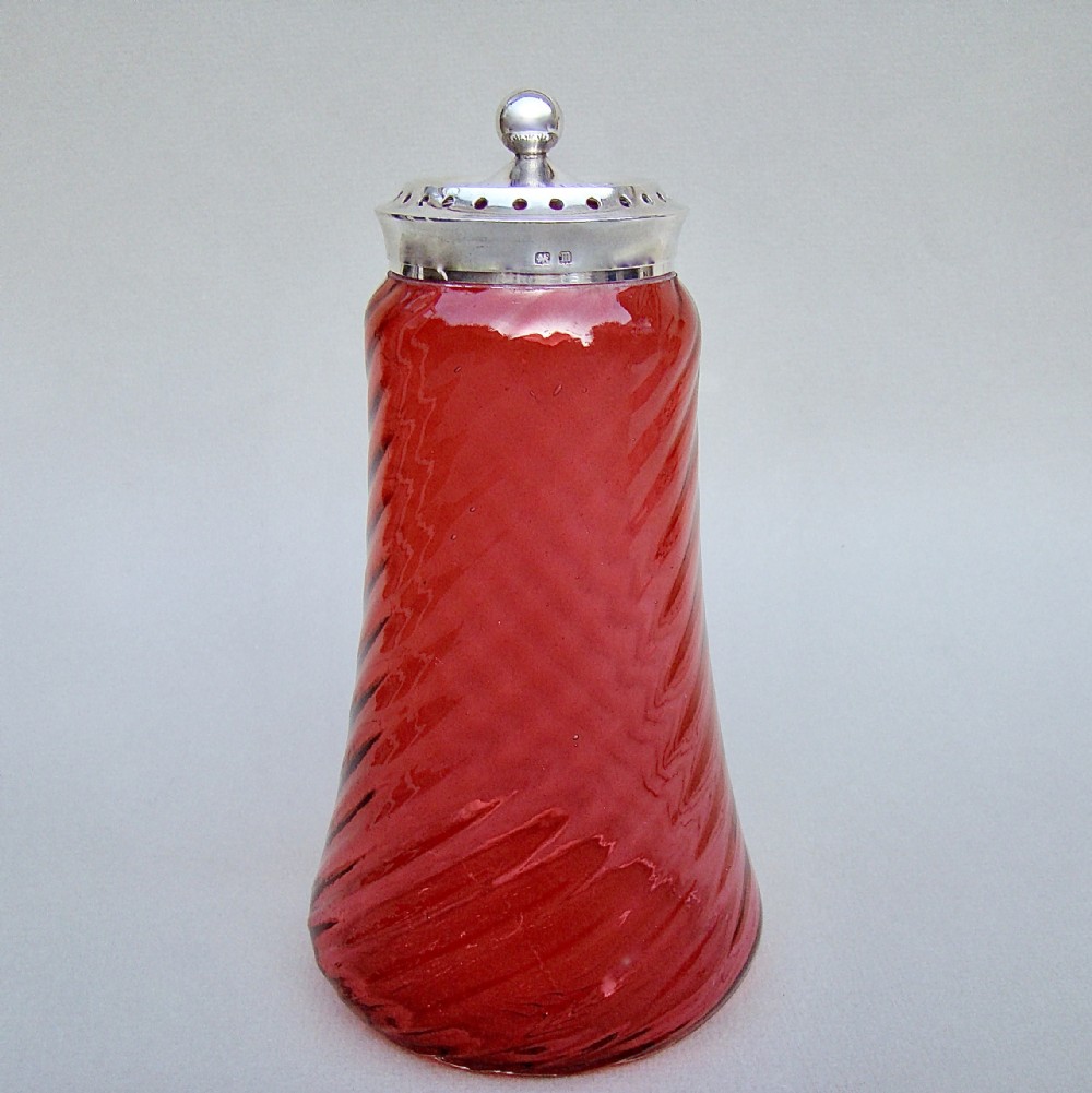 GEORGE V SILVER MOUNTED CRANBERRY GLASS SUGAR CASTER BY JOHN SHERWOOD & SON, BIRMINGHAM 1911